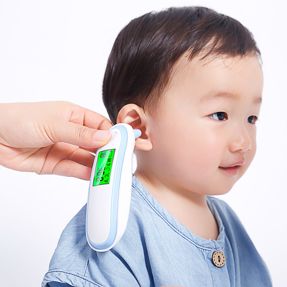 Child having their ear checked with a digital thermometer on a white background
