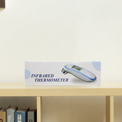 Infrared thermometer on a shelf with a white background
