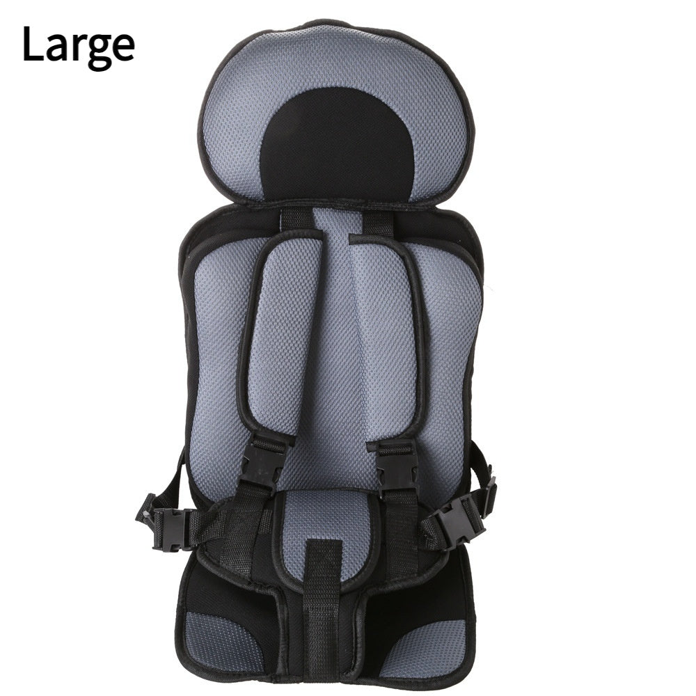 Large child safety seat with gray mesh and black straps on a white background