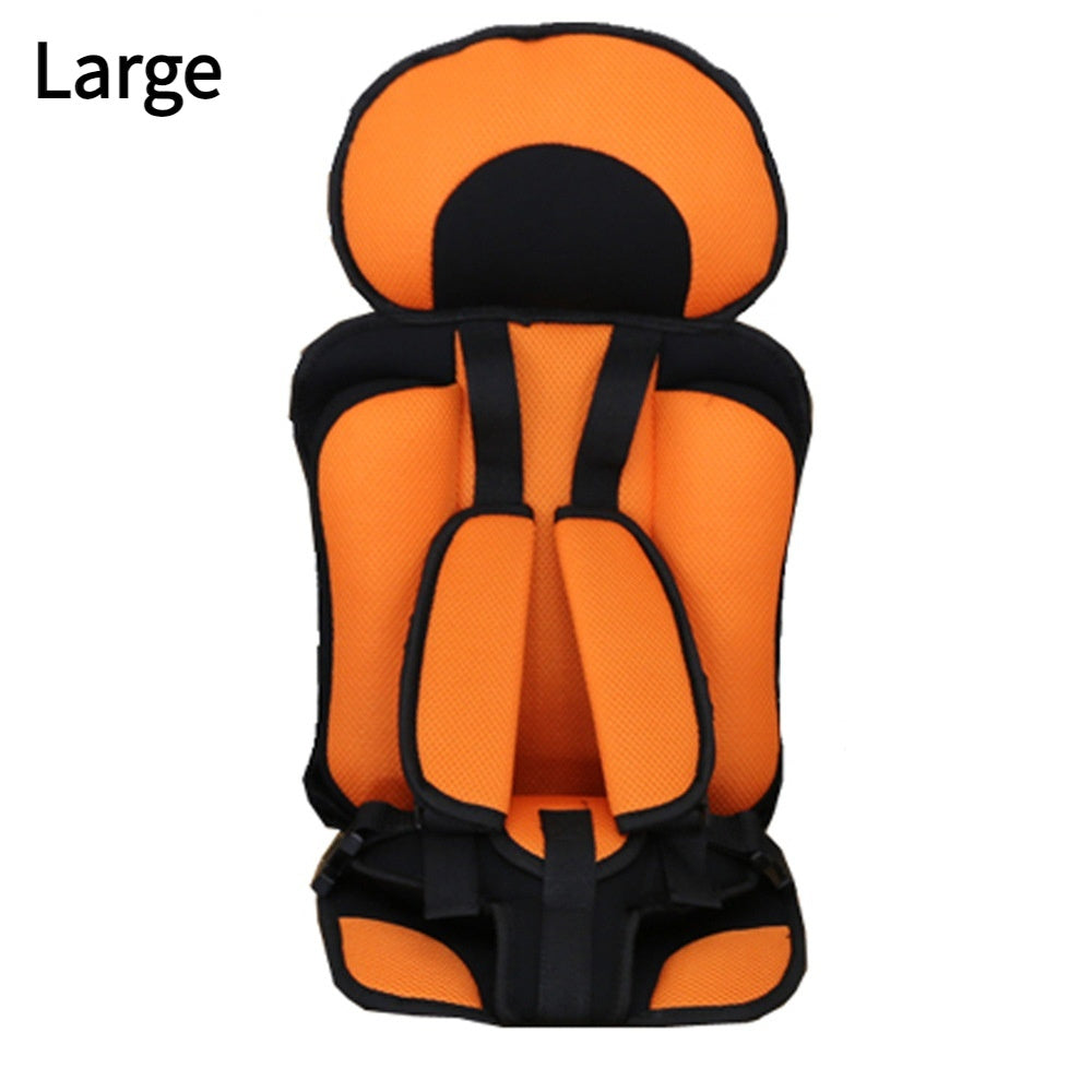 Orange and black child car seat on a white background