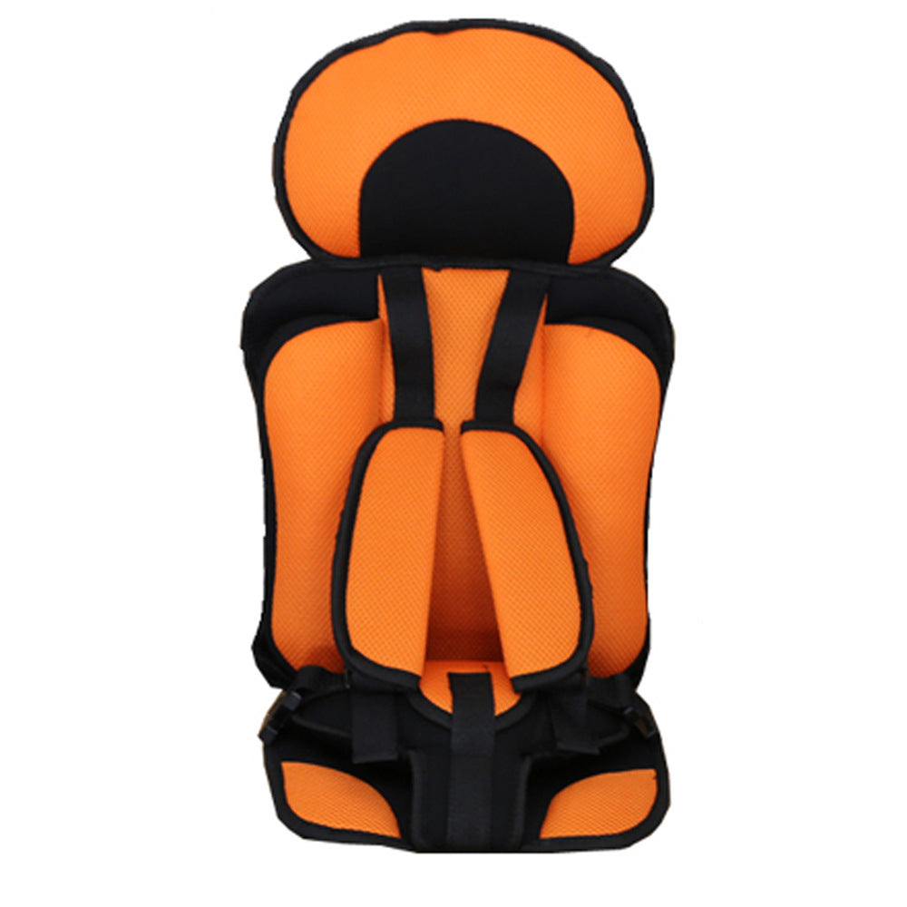 Orange and black child safety seat on a white background