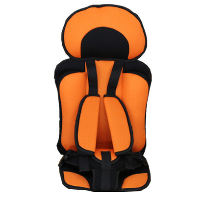Orange and black child safety seat on a white background
