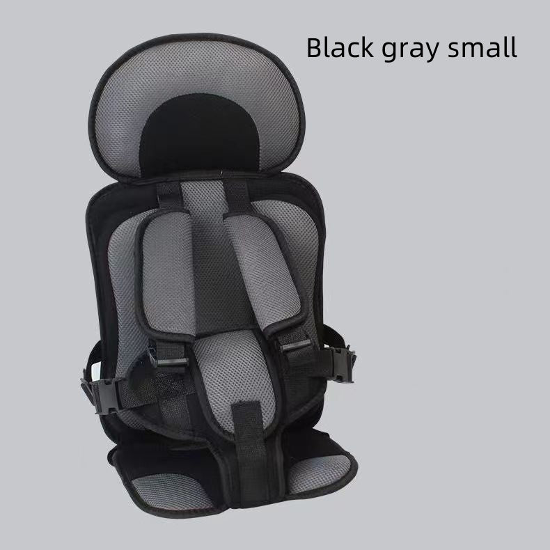 Black and gray child safety seat on a light gray background