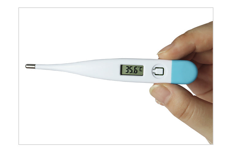 Digital thermometer held by a hand with a white background